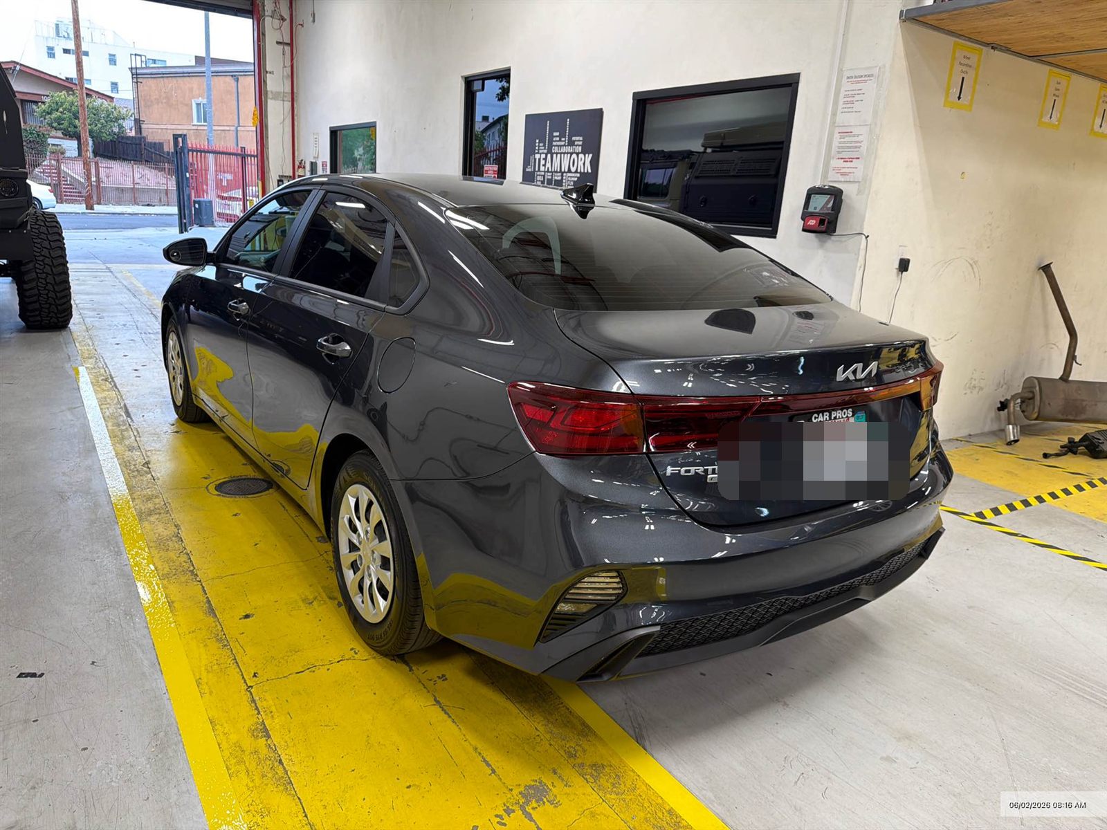Gray Kia Forte fully repaired — straight panels and factory-fresh paint